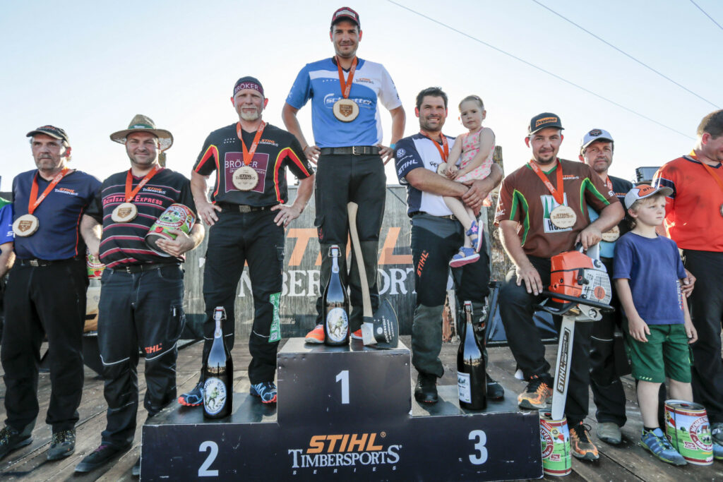 Robert Ebner ( middle , winner ) Dirk Braun ( left 2nd ) and Peter Bauer ( right )  of Germany  at the prize giving of the  Stihl Timbersports Amarok Cup 2017 in Murrhardt, Germany on Saturday 27th of May 2017